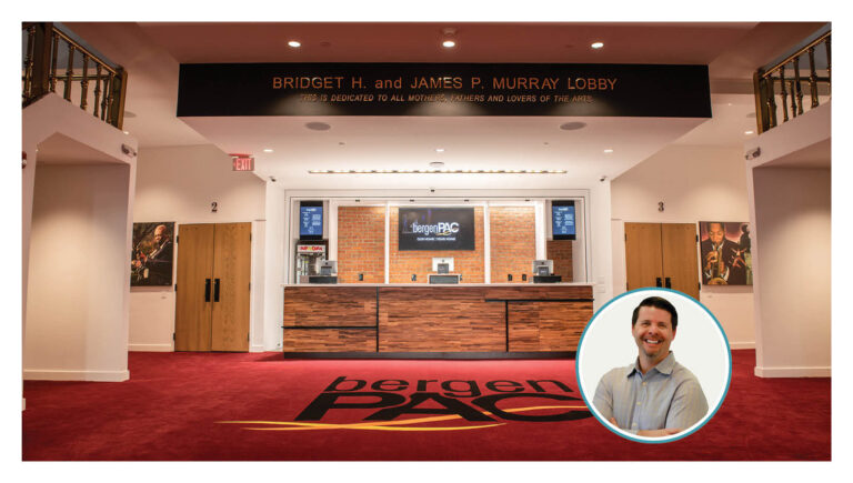 The main lobby of the iconic Bergen Performing Arts Center is a vibrant space that patrons want to spend time in. Pictured in the lobby are industrial design elements, such as wooden panels, juxtaposed to traditional elements, such as ornate gold railings. Also pictured is the author’s photo.