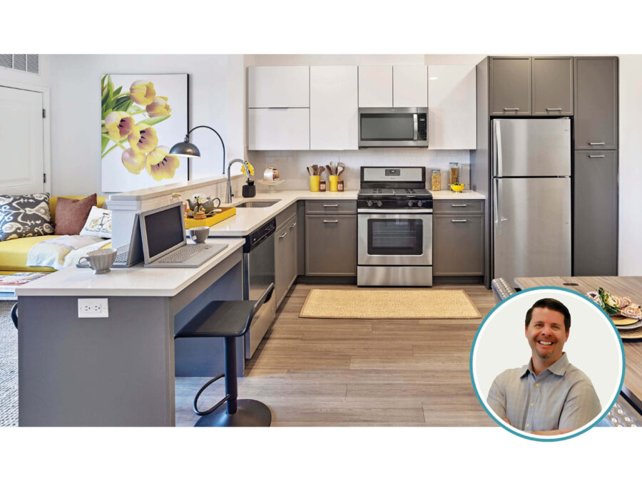 A residential unit with a portion of the counter used for working from home and the author's photo.