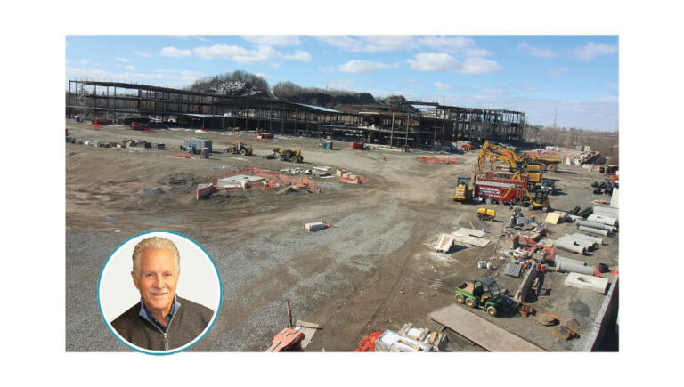 A large building, several hundred thousand square feet in size, under construction. The author's photo is also included.