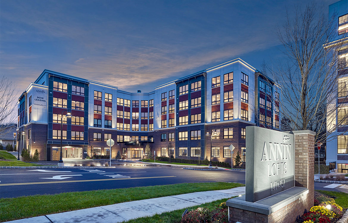 A nighttime view of the new construction portion of Annin Lofts, one of two buildings that comprise the development.