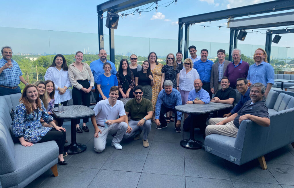 The DMR Architects team poses on the rooftop where they celebrated the firm's 32nd corporate anniversary.