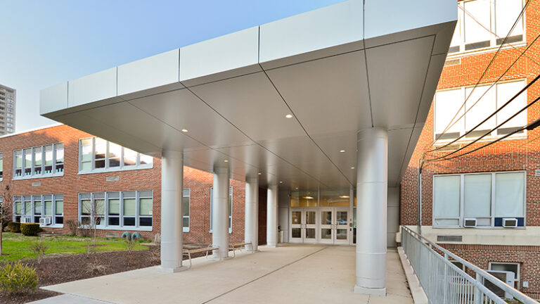At 1,100 SF, the new entrance at Hackensack High School serves more like like it's own space, which includes bench seating.
