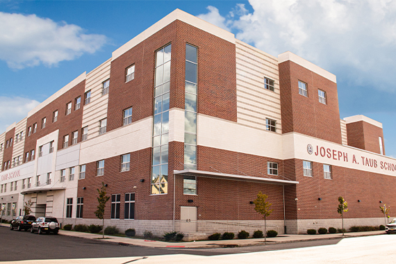An exterior view of the Joseph A. Taub School in Paterson, NJ, which has a mostly brick facade.