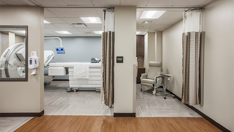 At the Hunterdon Healthcare Medical Office Building, one room shows Nuclear Medicine equipment and an adjacent patient room.