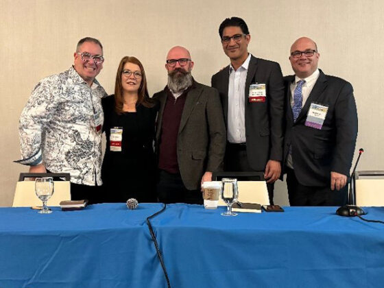 A group photo of the four panelists and moderator on the construction and design panel.