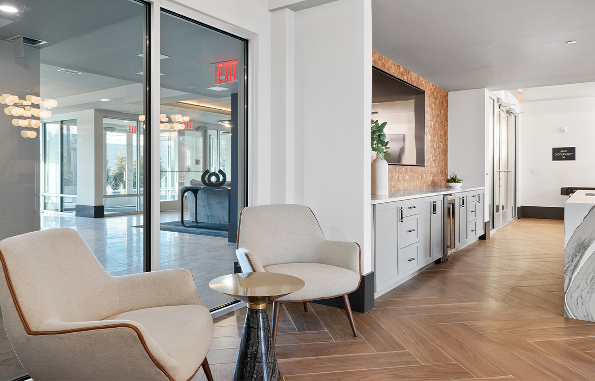 The resident lounge at The Vale, showing high-end finishes and a island/bar serving area, making it an attractive location for private parties.