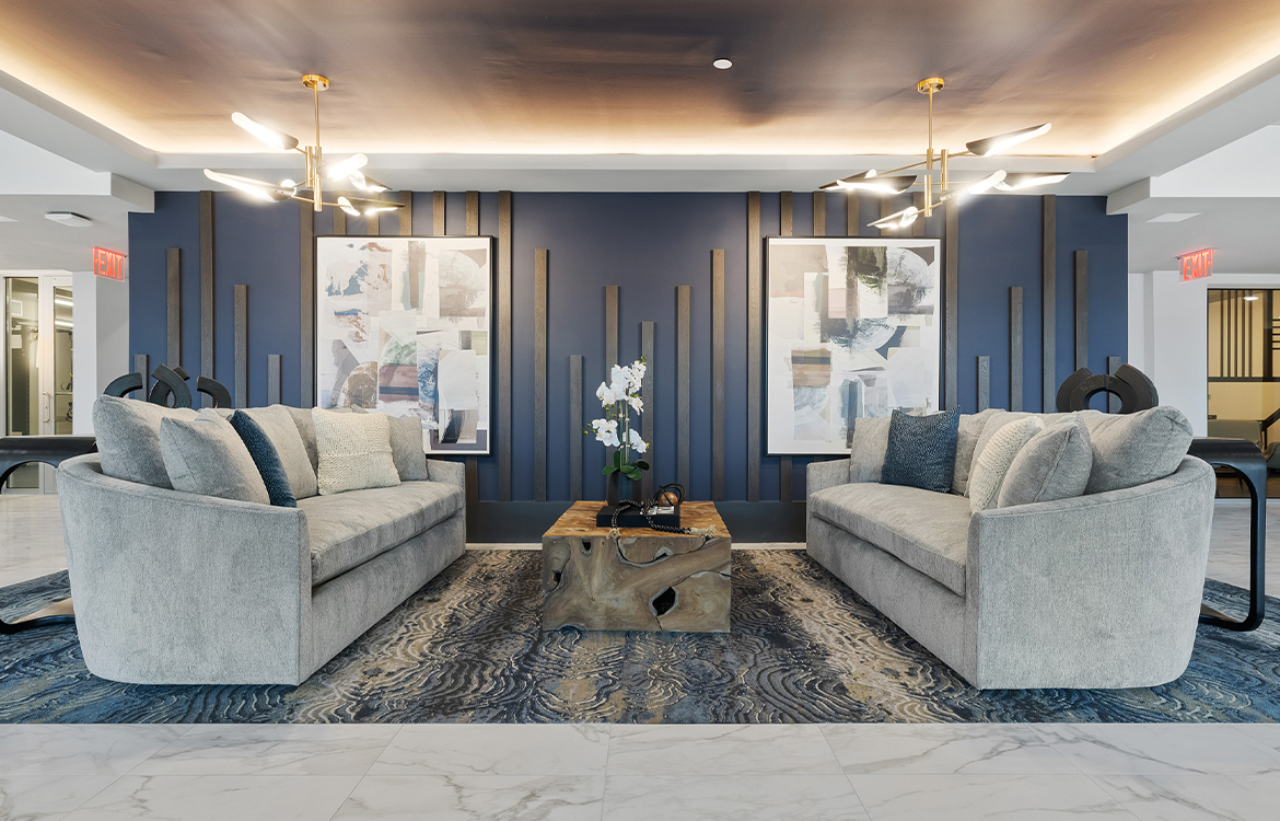 The lobby at The Vale shows the use of colors and textures, including an artistic installation on the wall.